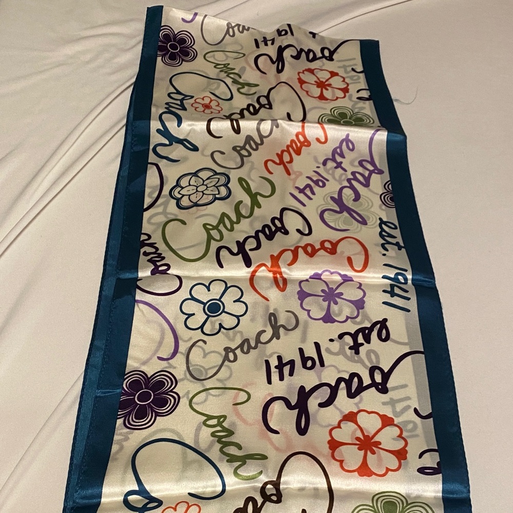 Coach Script and Floral Pattern Scarf with Teal Trim. Scarf is 100% silk